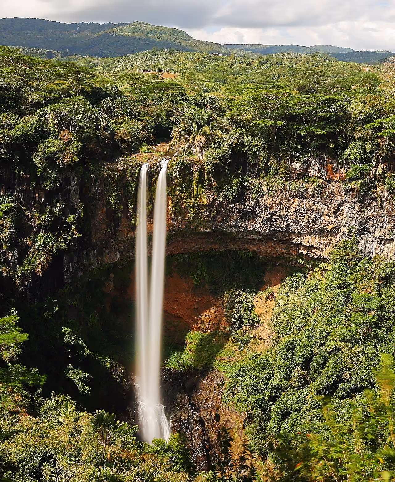 Chamarel waterfall surrounded by Mauritius’s green landscape